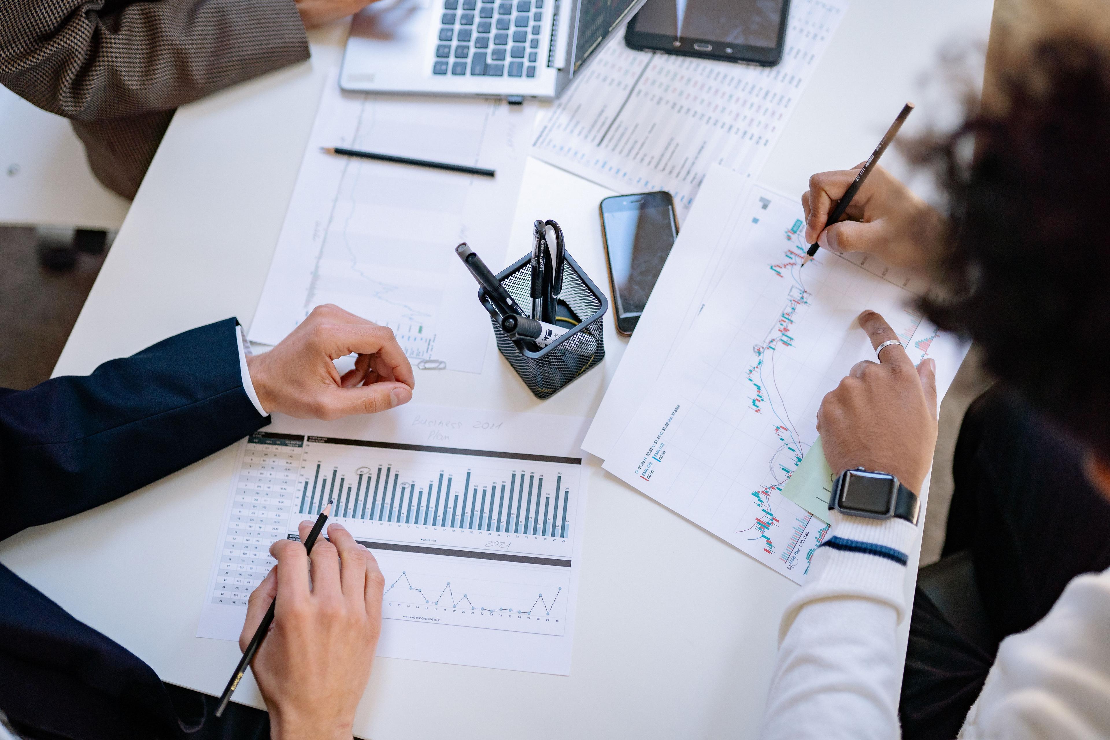 Team analyzing performance charts and results data